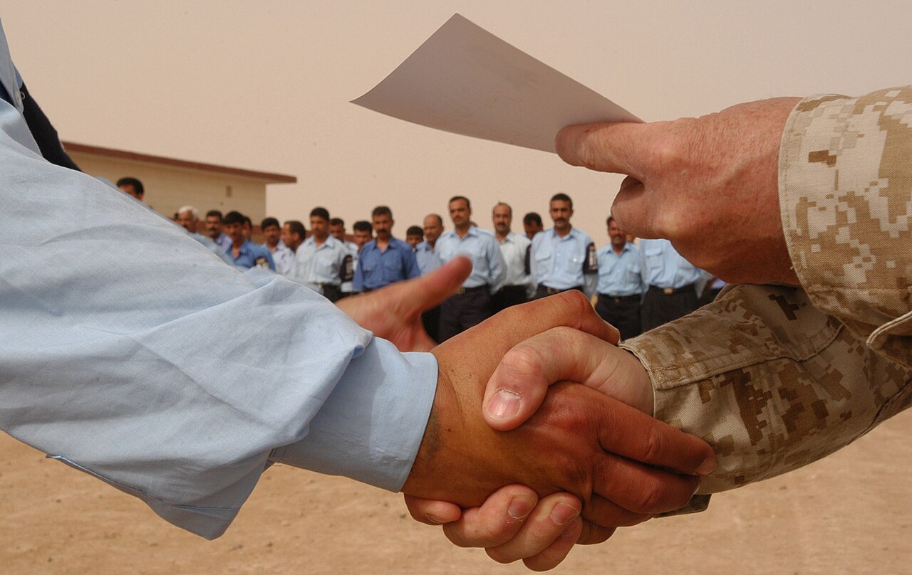 Two people shaking hands after an agreement